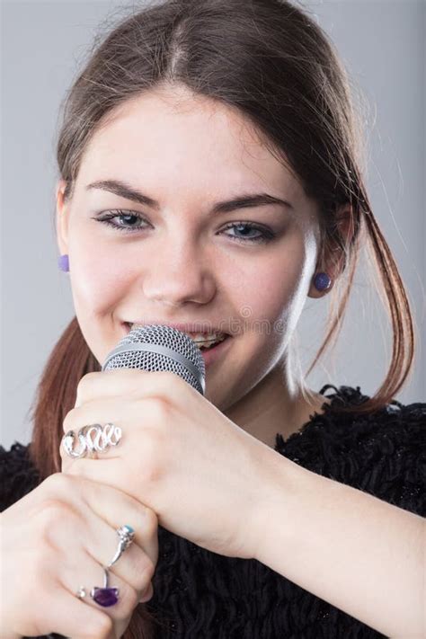 Girl Holding A Microphone And Singing Stock Image Image Of Microphone