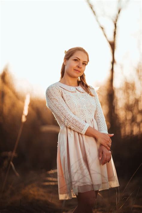 Beautiful Girl Standing In A Field On A Sunset Background Stock Image Image Of Colour Light