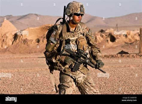 A Us Army Soldier On Combat Patrol In A Village August 18 2014 In