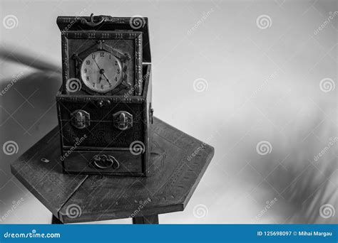 Antique Clock Sitting On An Old Table Stock Image Image Of Minutes