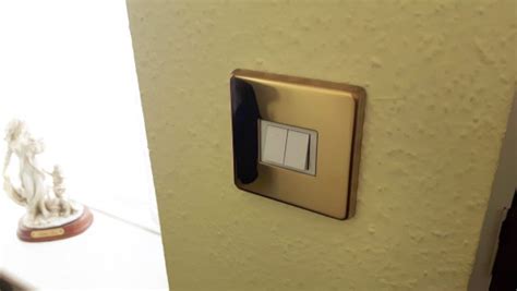 Use a screwdriver to tighten the screws and cover plate. Light Switch Cover Plate Conversion in Victorian brass Single