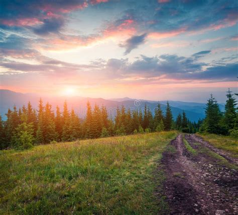 Colorful Summer Sunrise In The Carpathian Mountains With Old Country