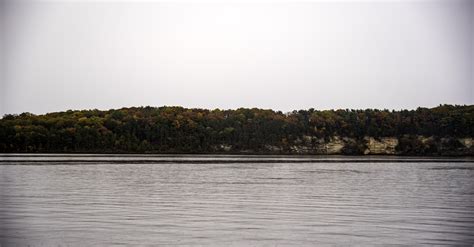 Treeline And Horizon Across The Wisconsin River With Autumn Trees Image