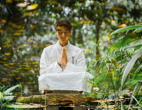 Asian Man Sit In Meditation In Zen Style Traditional Chinese Clothing