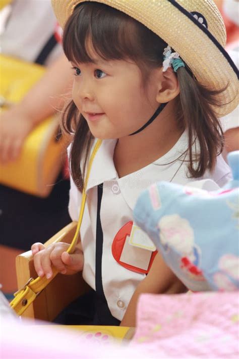 Japanese Girl In Kindergarten Uniform In Her Classroom Stock Photo