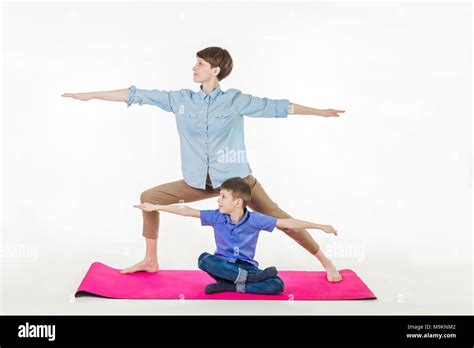 Mother And Son Doing Yoga Spending A Good Time Together Isolated On White Stock Photo Alamy