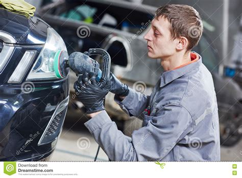 Auto Mechanic Buffing And Polishing Car Headlight Stock Image Image