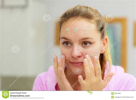 Woman Cleaning Her Face With Scrub In Bathroom Stock Image Image Of Purifying Cleansing