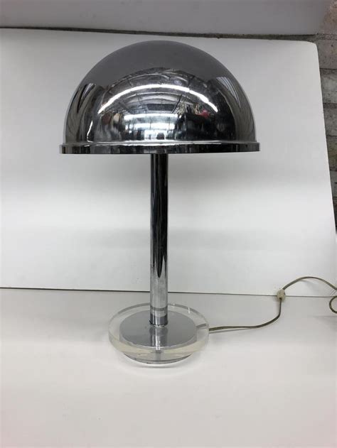 Vintage lucite and brass dining table, 1980s. Lot - A chrome and lucite desk lamp modern
