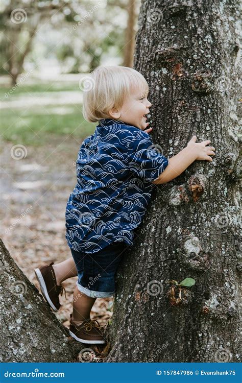 Adorably Happy And Cute Little Caucasian Toddler Baby Boy With Long