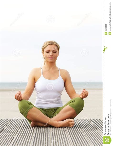 Beautiful Young Woman Sitting In Yoga Pose Outdoors Stock