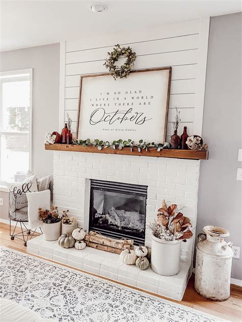 A Living Room With A Fire Place And Christmas Decorations On The Mantel