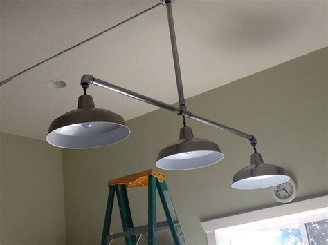 Task lighting puts the light where you need it, whether you're trying to find the right eyelet or thread an uncooperative needle. New lights hubby made for craft room! Galvanized pipe from ...