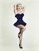 Betty Grable posing with one leg up and arms behind her head, 1950s ...