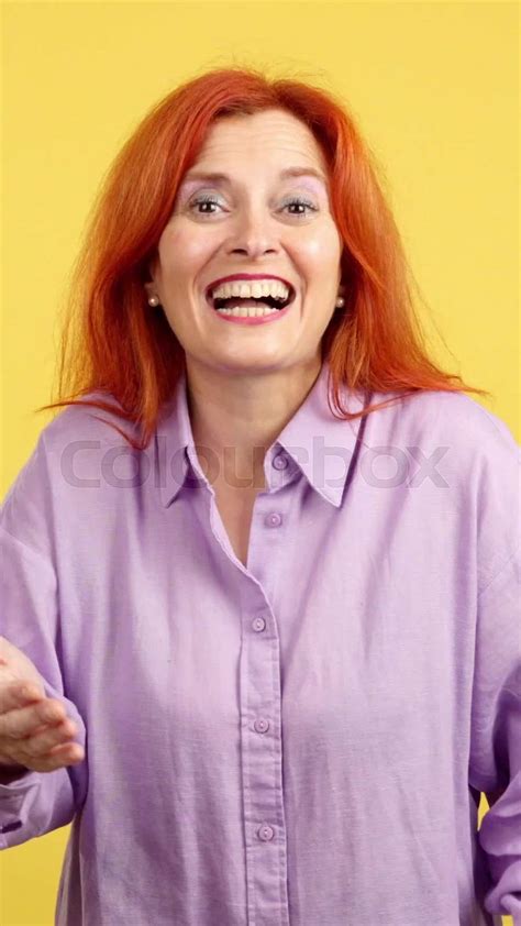 redheaded mature and affectionate mother throwing a kiss stock video colourbox