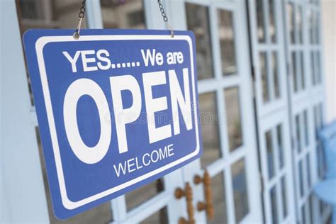 Yes We`re Open Sign On The Blue Doors In Store Welcome Sign At The