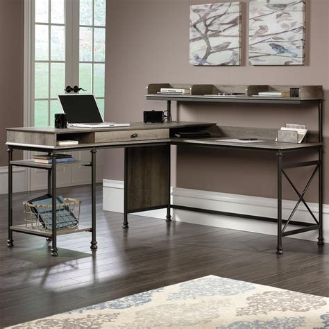 The trendy and industrial look of this l shaped computer desk will be the focal point in your modern home office. Sauder Canal Street L-Shaped Desk with USB Ports and ...