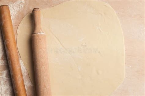 Rolled Dough With Rolling Pin On Wooden Background Top View Stock