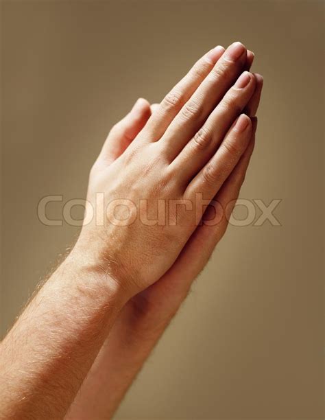 Hands Clasped In Prayer Stock Photo Colourbox