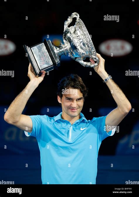 Roger Federer Sui Holding The Winners Trophy Up In The Air At The
