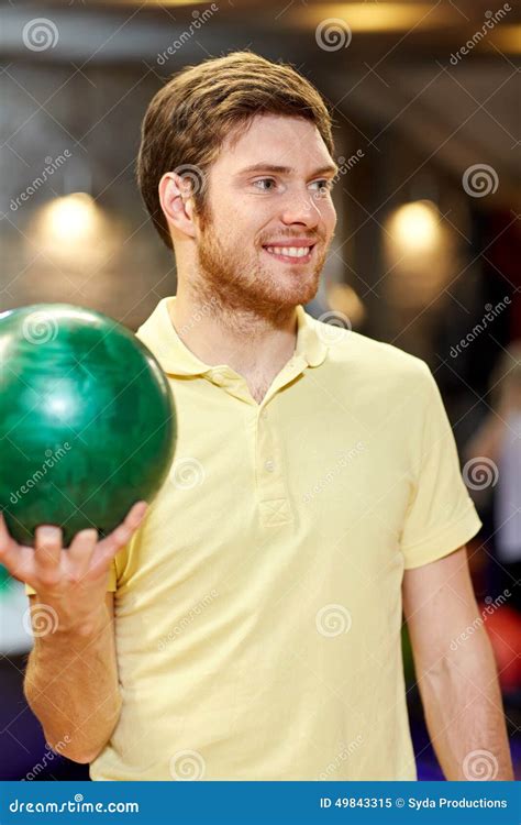 Happy Young Man Holding Ball In Bowling Club Stock Image Image Of