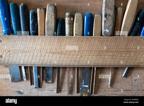 Wooden Rack Of Old Rusty Chisels Stock Photo Alamy