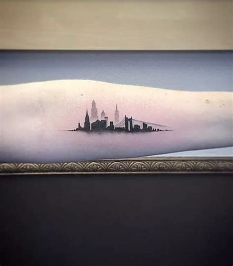 A City Skyline Tattoo On The Arm