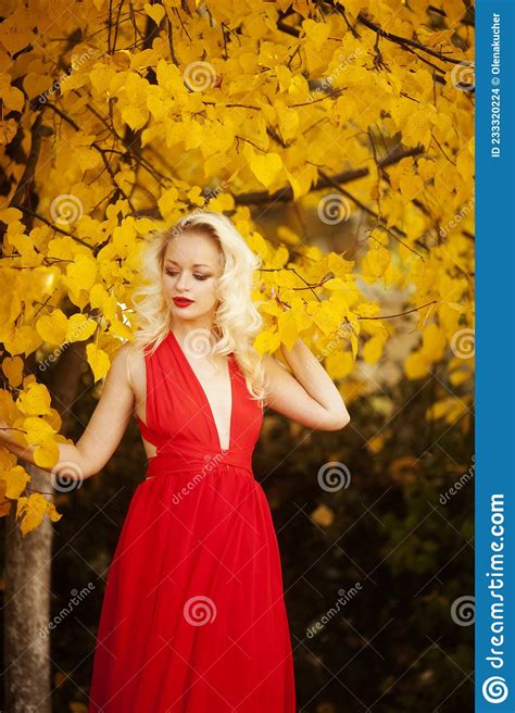 Beautiful Young Girl With White Hair In A Red Dress Dancing In The