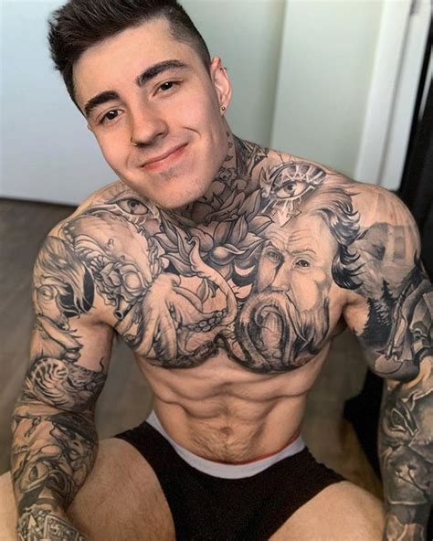 A Man With Lots Of Tattoos On His Chest