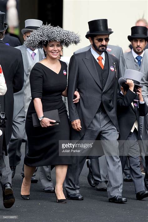 A Group Of People In Suits And Hats Walking Down The Street With Other