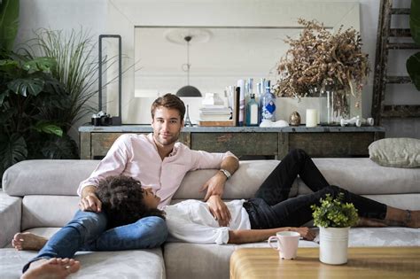 Affectionate Couple Relaxing On Sofa Stock Photo