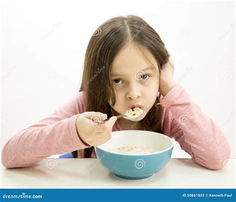 Young Girl Eating Cereal Stock Photo Image Of Grains 50861832
