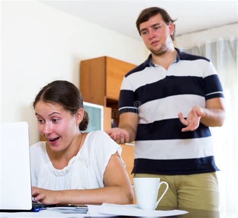 unhappy husband distracting busy wife from work stock image image of online ordinary 68405449