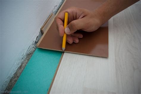 If you are ready to upgrade your existing floor, you will need to remove the old vinyl once it's cut, gently lift the strip of vinyl until you encounter resistance from the glue near the perimeter. How to cut laminate flooring lengthwise | HowToSpecialist - How to Build, Step by Step DIY Plans
