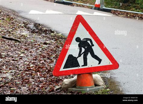 Slow Down Men Work Sign Hi Res Stock Photography And Images Alamy