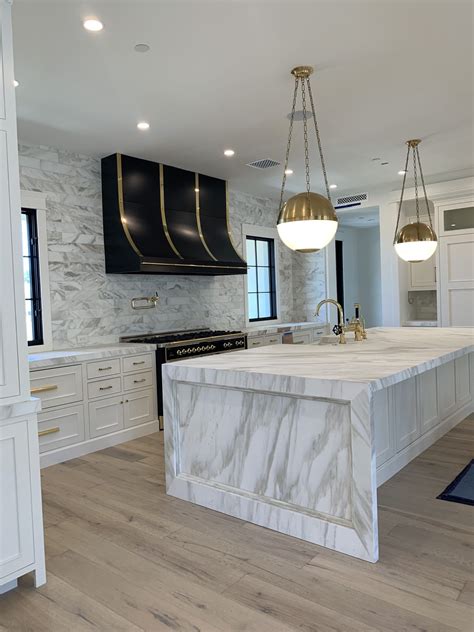White Kitchen With Marble Island Oversized Kitchen Island Drizzled In