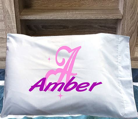 A Pillow That Has The Word Amber On It
