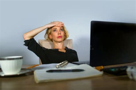Beautiful Depressed And Sad Blonde Woman Working With Laptop Computer