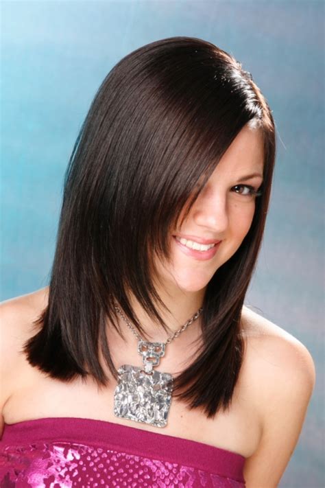 This is medium length layered hairstyles for women where the hair is cut in layers in such a way that it removes weight without reducing length. Medium Layered Haircuts