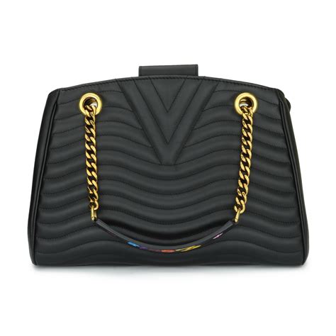 The new wave collection by louis vuitton launches in stores today with an iconic yet contemporary design. Louis Vuitton New Wave Chain Tote Black Leather with Aged ...