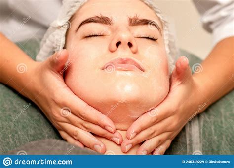 Face Massage Beautiful Caucasian Young White Woman Having A Facial Massage With Closed Eyes In