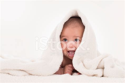 Baby Lying Under White Blanket Stock Photo Royalty Free Freeimages