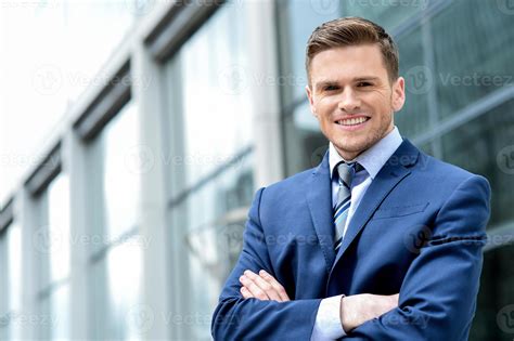 Young Businessman Smiling In A Office Outdoor 1027183 Stock Photo At