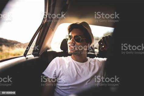 Enjoying The Road Trip On The Backseat Stock Photo Download Image Now