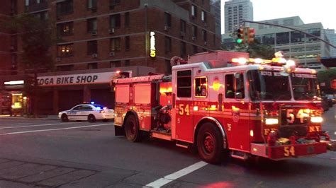 Nypd Esu And Fdny Fire Trucks Responding On A Friday Night In New York