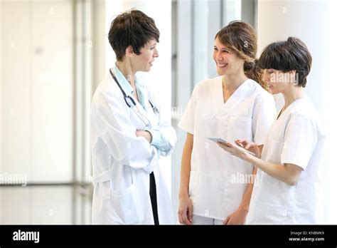 Doctors And Nurses Talking In Corridor Hospital Stock Photo Alamy