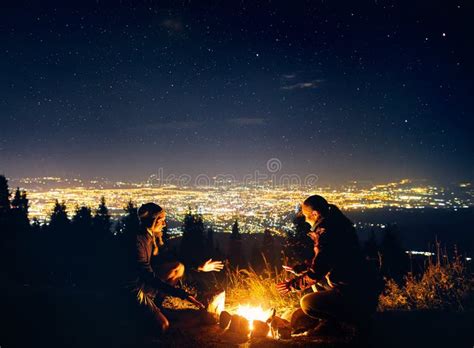 Romantic Couple Near Campfire At Starry Night Stock Image Image Of