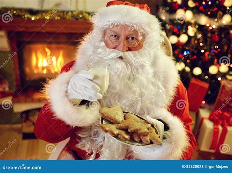Santa Claus Enjoying In Cookies And Milk Stock Photo Image Of Eating