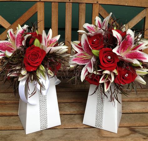 Red Roses And Stargazer Lilies Brides Bouquet Accented With Crystal