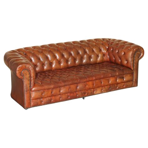 FULLY COIL SPRUNG VINTAGE 1920 S HAND DYED BROWN LEATHER CHESTERFIELD